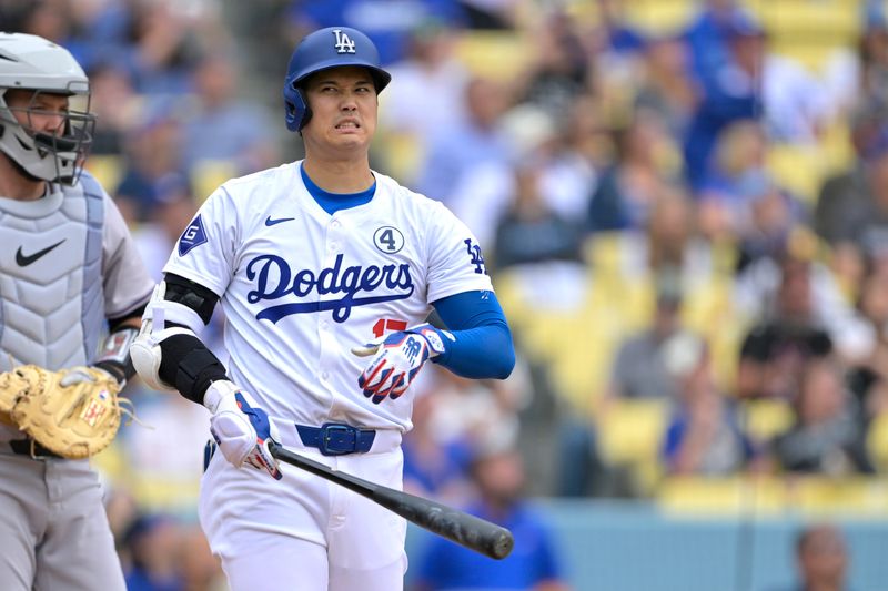 Jun 2, 2024; Los Angeles, California, USA;  Los Angeles Dodgers designated hitter Shohei Ohtani (17) reacts after fouling off a pitch in the fifth inning against the Colorado Rockies at Dodger Stadium. Mandatory Credit: Jayne Kamin-Oncea-USA TODAY Sports