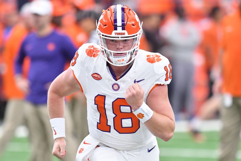 Sep 30, 2023; Syracuse, New York, USA; Clemson Tigers quarterback Hunter Helms (18) warms up before a game against the Syracuse Orange at the JMA Wireless Dome. Mandatory Credit: Mark Konezny-USA TODAY Sports