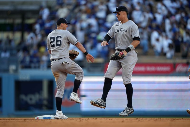 Jun 3, 2023; Los Angeles, California, USA; New York Yankees right fielder Aaron Judge (99) celebrates with third baseman DJ LeMahieu (26) after the game against the Los Angeles Dodgers at Dodger Stadium. Mandatory Credit: Kirby Lee-USA TODAY Sports