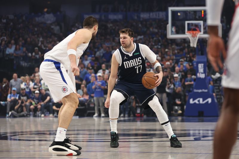 DALLAS, TX - APRIL 28: Luka Doncic #77 of the Dallas Mavericks dribbles the ball during the game against the LA Clippers during Round 1 Game 4 of the 2024 NBA Playoffs on April 28, 2024 at the American Airlines Center in Dallas, Texas. NOTE TO USER: User expressly acknowledges and agrees that, by downloading and or using this photograph, User is consenting to the terms and conditions of the Getty Images License Agreement. Mandatory Copyright Notice: Copyright 2024 NBAE (Photo by Tim Heitman/NBAE via Getty Images)