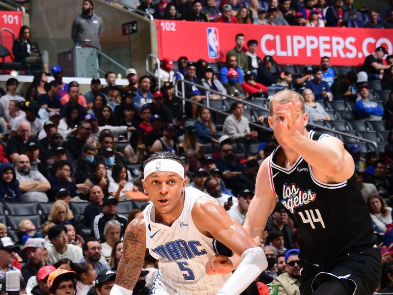 LOS ANGELES, CA - MARCH 18: Paolo Banchero #5 of the Orlando Magic moves the ball during the game against the LA Clippers on March 18, 2023 at Crypto.Com Arena in Los Angeles, California. NOTE TO USER: User expressly acknowledges and agrees that, by downloading and/or using this Photograph, user is consenting to the terms and conditions of the Getty Images License Agreement. Mandatory Copyright Notice: Copyright 2023 NBAE (Photo by Adam Pantozzi/NBAE via Getty Images)