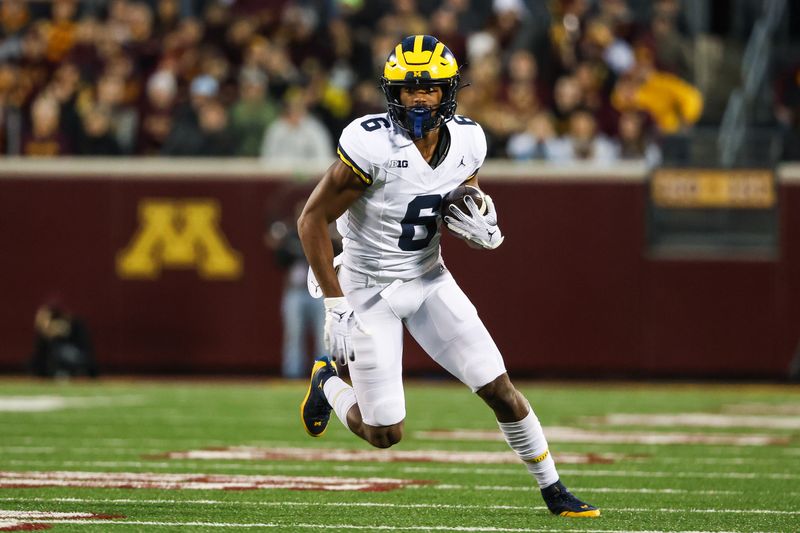 Oct 7, 2023; Minneapolis, Minnesota, USA; Michigan Wolverines wide receiver Cornelius Johnson (6) makes a catch against the Minnesota Golden Gophers during the first quarter at Huntington Bank Stadium. Mandatory Credit: Matt Krohn-USA TODAY Sports