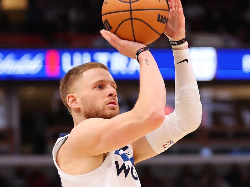 CHICAGO, ILLINOIS - NOVEMBER 07: Donte DiVincenzo #0 of the Minnesota Timberwolves shoots a three pointer against the Chicago Bulls during the second half at the United Center on November 07, 2024 in Chicago, Illinois. NOTE TO USER: User expressly acknowledges and agrees that, by downloading and or using this photograph, User is consenting to the terms and conditions of the Getty Images License Agreement.  (Photo by Michael Reaves/Getty Images)