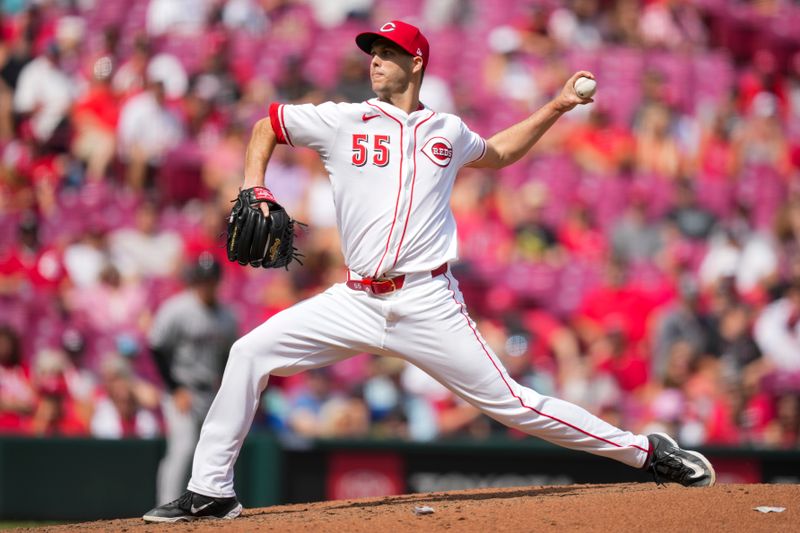 Jun 8, 2025; Cincinnati, Ohio, USA; Cincinnati Reds pitcher Taylor Rogers (55) throws against the Arizona Diamondbacks in the eighth inning at Great American Ball Park. Mandatory Credit: Aaron Doster-Imagn Images