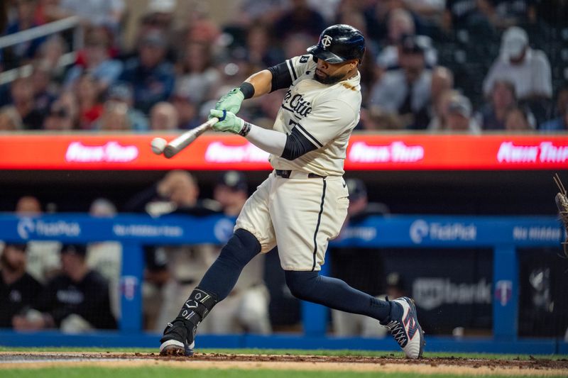 Sep 26, 2024; Minneapolis, Minnesota, USA; Minnesota Twins first base Carlos Santana (30) hits in the second inning against the Miami Marlins at Target Field. Mandatory Credit: Matt Blewett-Imagn Images