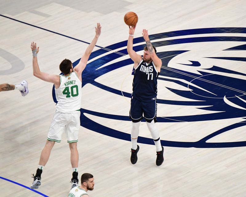 BOSTON, MA - JUNE 14:  Luka Doncic #77 of the Dallas Mavericks shoots a three point basket during the game  against Luke Kornet #40 of the Boston Celtics during Game Four of the 2024 NBA Finals on June 14, 2024 at the American Airlines Center in Dallas, Texas. NOTE TO USER: User expressly acknowledges and agrees that, by downloading and or using this photograph, User is consenting to the terms and conditions of the Getty Images License Agreement. Mandatory Copyright Notice: Copyright 2024 NBAE (Photo by Adam Pantozzi/NBAE via Getty Images)