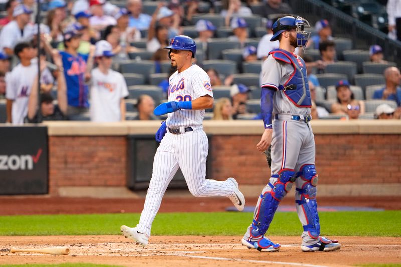 Aug 30, 2023; New York City, New York, USA;  New York Mets left fielder Rafael Ortega (30) scores a run on New York Mets center fielder Brandon Nimmo (not pictured) RBI double during the second inning at Citi Field. Mandatory Credit: Gregory Fisher-USA TODAY Sports