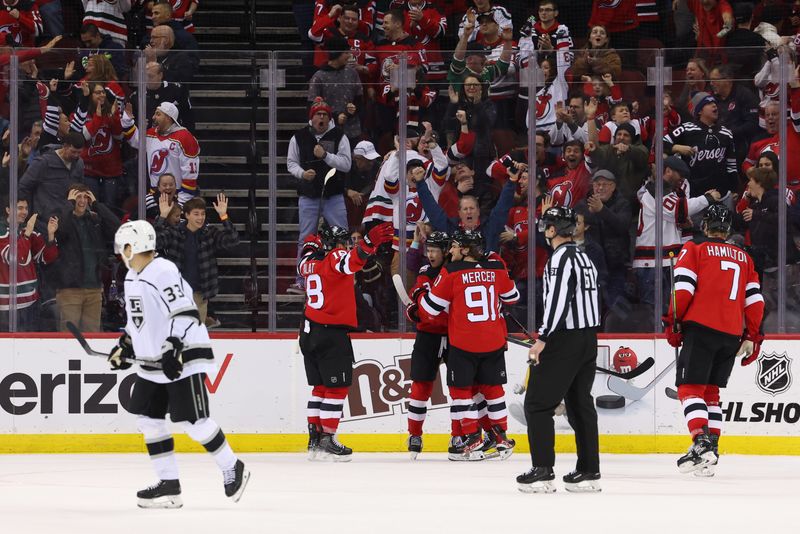 Feb 23, 2023; Newark, New Jersey, USA; New Jersey Devils center Nico Hischier (13) celebrates his goal against the Los Angeles Kings during the third period at Prudential Center. Mandatory Credit: Ed Mulholland-USA TODAY Sports