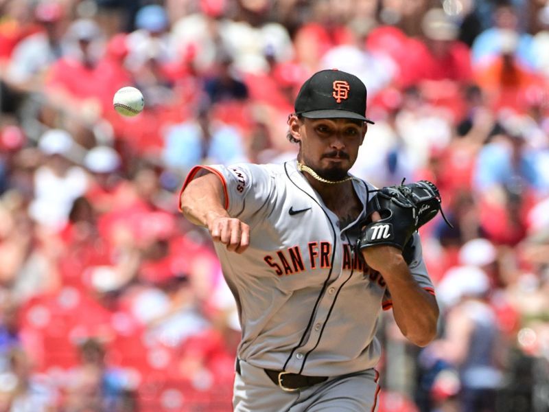 Jun 22, 2024; St. Louis, Missouri, USA; San Francisco Giants pitcher Jordan Hicks tries to pickoff St. Louis Cardinals outfielder Alec Burleson (not shown) at first base in the first inning at Busch Stadium. Mandatory Credit: Tim Vizer-USA TODAY Sports