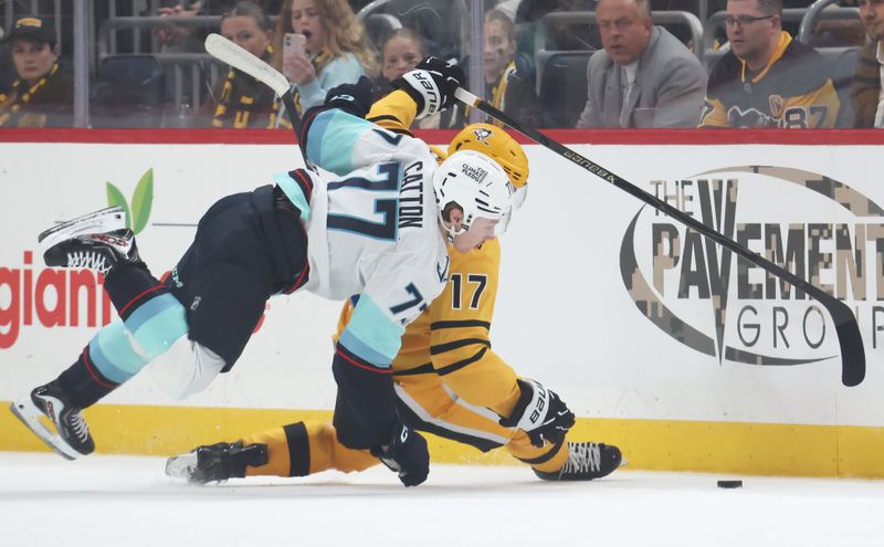 Nov 22, 2025; Pittsburgh, Pennsylvania, USA;  Seattle Kraken center Berkly Catton (77) commits an interference penalty against Pittsburgh Penguins right wing Bryan Rust (17) during the first period at PPG Paints Arena. Mandatory Credit: Charles LeClaire-Imagn Images
