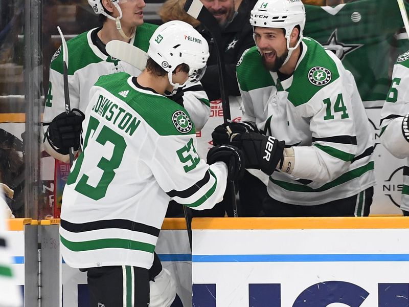 Oct 13, 2022; Nashville, Tennessee, USA; Dallas Stars center Wyatt Johnston (53) celebrates with left wing Jamie Benn (14) after a goal during the third period against the Nashville Predators at Bridgestone Arena. Mandatory Credit: Christopher Hanewinckel-USA TODAY Sports