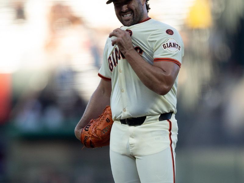 Aug 14, 2024; San Francisco, California, USA; San Francisco Giants starting pitcher Robbie Ray (23) reacts to allowing a walk against the Atlanta Braves during the first inning at Oracle Park. Mandatory Credit: D. Ross Cameron-USA TODAY Sports