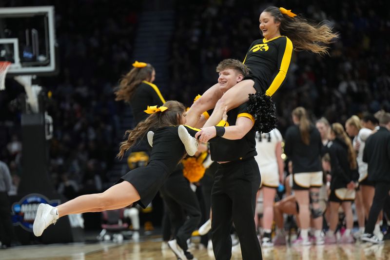 Mar 24, 2023; Seattle, WA, USA; Iowa Hawkeyes cheerleaders perform against the Colorado Buffaloes in the second half at Climate Pledge Arena. Mandatory Credit: Kirby Lee-USA TODAY Sports