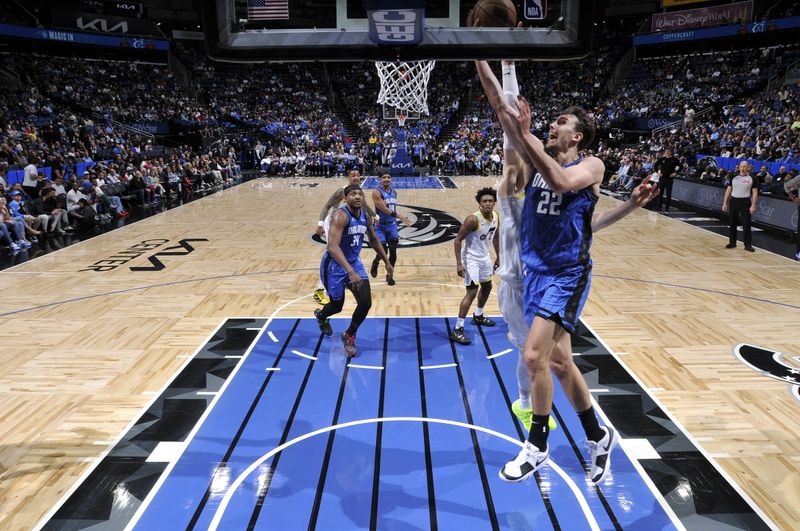 ORLANDO, FL - FEBRUARY 29: Franz Wagner #22 of the Orlando Magic drives to the basket during the game against the Utah Jazz on February 29, 2024 at Amway Center in Orlando, Florida. NOTE TO USER: User expressly acknowledges and agrees that, by downloading and or using this photograph, User is consenting to the terms and conditions of the Getty Images License Agreement. Mandatory Copyright Notice: Copyright 2024 NBAE (Photo by Fernando Medina/NBAE via Getty Images)