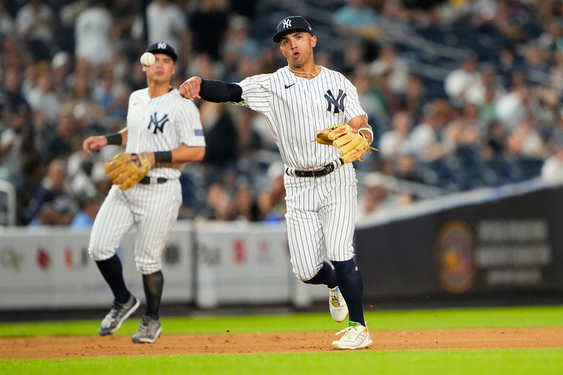 Sep 7, 2023; Bronx, New York, USA; New York Yankees third baseman Oswald Peraza (91) throws out  Detroit Tigers third baseman Andre Lipcius (not pictured) during the eighth inning at Yankee Stadium. Mandatory Credit: Gregory Fisher-USA TODAY Sports