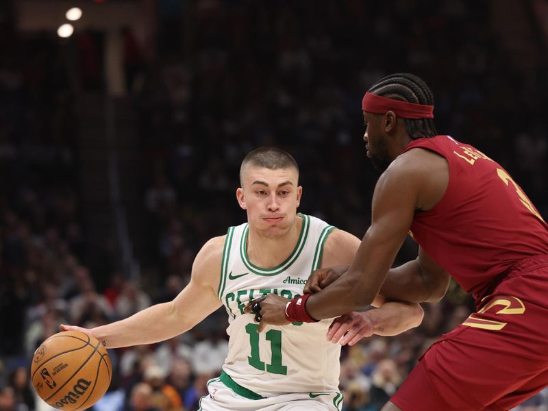 CLEVELAND, OH - DECEMBER 1: Payton Pritchard #11 of the Boston Celtics drives to the basket during the game against the Cleveland Cavaliers on December 1, 2024 at Rocket Mortgage FieldHouse in Cleveland, Ohio. NOTE TO USER: User expressly acknowledges and agrees that, by downloading and/or using this Photograph, user is consenting to the terms and conditions of the Getty Images License Agreement. Mandatory Copyright Notice: Copyright 2024 NBAE (Photo by  Lauren Leigh Bacho/NBAE via Getty Images)