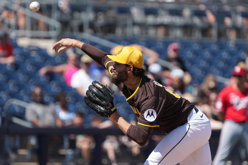 Mar 22, 2025; Peoria, Arizona, USA; San Diego Padres pitcher Dylan Cease (84) throws against the Cincinnati Reds in the third inning at Peoria Sports Complex. Mandatory Credit: Rick Scuteri-Imagn Images