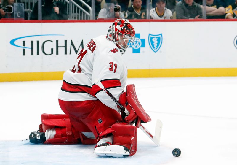 Oct 18, 2024; Pittsburgh, Pennsylvania, USA;  Carolina Hurricanes goaltender Frederik Andersen (31) makes a save against the Pittsburgh Penguins during the third period at PPG Paints Arena. Mandatory Credit: Charles LeClaire-Imagn Images