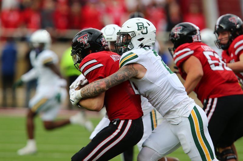 Oct 19, 2024; Lubbock, Texas, USA;  Baylor Bears defensive back Matt Jones (2) sacks Texas Tech Red Raiders quarterback Behren Morton (2) in the second half at Jones AT&T Stadium and Cody Campbell Field. Mandatory Credit: Michael C. Johnson-Imagn Images