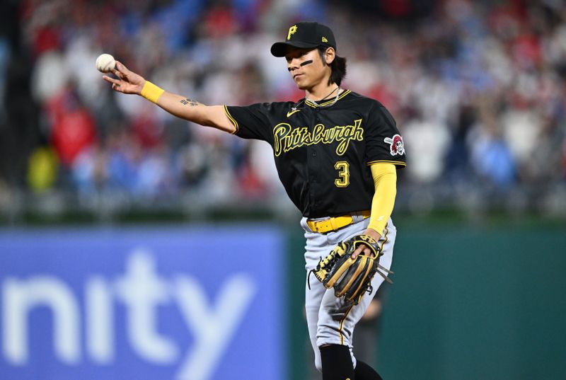 Sep 26, 2023; Philadelphia, Pennsylvania, USA; Pittsburgh Pirates infielder Ji Hwan Bae (3) throws to first against the Philadelphia Phillies in the ninth inning at Citizens Bank Park. Mandatory Credit: Kyle Ross-USA TODAY Sports