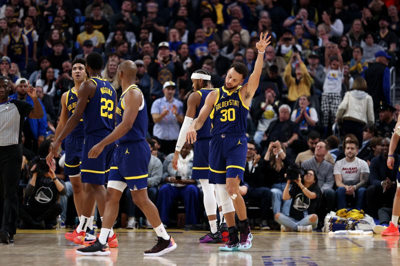 SAN FRANCISCO, CALIFORNIA - DECEMBER 28: Stephen Curry #30 of the Golden State Warriors reacts after he made a three-point basket and was fouled by the Miami Heat at Chase Center on December 28, 2023 in San Francisco, California. NOTE TO USER: User expressly acknowledges and agrees that, by downloading and or using this photograph, User is consenting to the terms and conditions of the Getty Images License Agreement.  (Photo by Ezra Shaw/Getty Images)