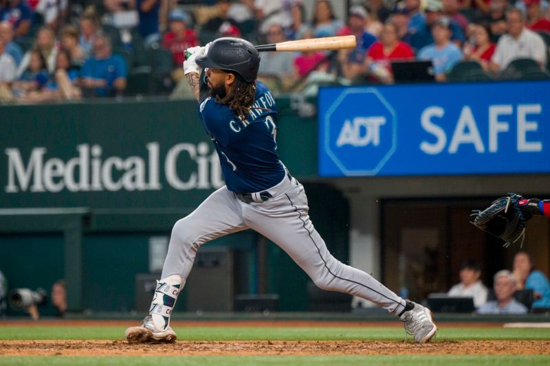 Sep 24, 2023; Arlington, Texas, USA; Seattle Mariners shortstop J.P. Crawford (3) hits a single against the Texas Rangers during the game at Globe Life Field. Mandatory Credit: Jerome Miron-USA TODAY Sports