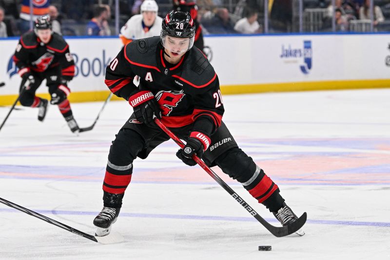 Mar 19, 2024; Elmont, New York, USA; Carolina Hurricanes center Sebastian Aho (20) skates across the blue line against the New York Islanders during the third period at UBS Arena. Mandatory Credit: Dennis Schneidler-USA TODAY Sports