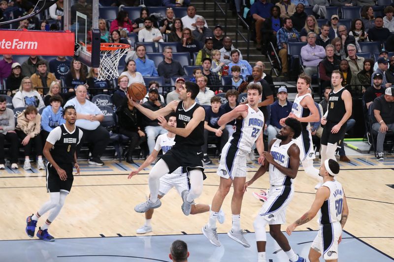 MEMPHIS, TN - JANUARY 26:  Santi Aldama #7 of the Memphis Grizzlies drives to the basket during the game against the Orlando Magic on January 26, 2024 at FedExForum in Memphis, Tennessee. NOTE TO USER: User expressly acknowledges and agrees that, by downloading and or using this photograph, User is consenting to the terms and conditions of the Getty Images License Agreement. Mandatory Copyright Notice: Copyright 2024 NBAE (Photo by Joe Murphy/NBAE via Getty Images)