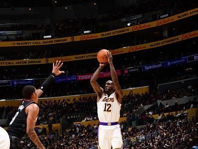 LOS ANGELES, CA - DECEMBER 2:  Taurean Prince #12 of the Los Angeles Lakers shoots a three point basket during the game  on December 2, 2023 at Crypto.Com Arena in Los Angeles, California. NOTE TO USER: User expressly acknowledges and agrees that, by downloading and/or using this Photograph, user is consenting to the terms and conditions of the Getty Images License Agreement. Mandatory Copyright Notice: Copyright 2023 NBAE (Photo by Adam Pantozzi/NBAE via Getty Images)