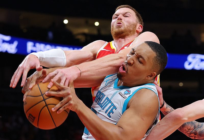 ATLANTA, GEORGIA - APRIL 10:  Grant Williams #2 of the Charlotte Hornets and Dylan Windler #20 of the Atlanta Hawks battle for a rebound during the fourth quarter at State Farm Arena on April 10, 2024 in Atlanta, Georgia.  NOTE TO USER: User expressly acknowledges and agrees that, by downloading and/or using this photograph, user is consenting to the terms and conditions of the Getty Images License Agreement.  (Photo by Kevin C. Cox/Getty Images)