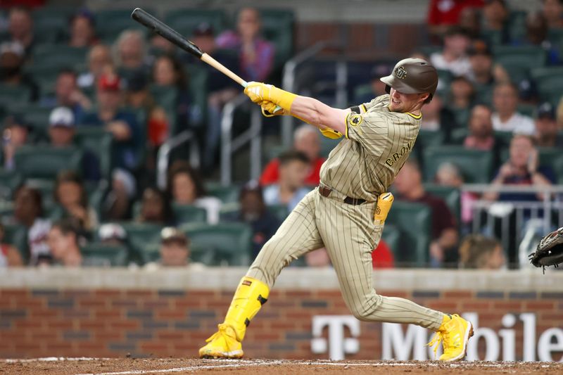 May 17, 2024; Atlanta, Georgia, USA; San Diego Padres first baseman Jake Cronenworth (9) hits a RBI single against the Atlanta Braves in the fifth inning at Truist Park. Mandatory Credit: Brett Davis-USA TODAY Sports