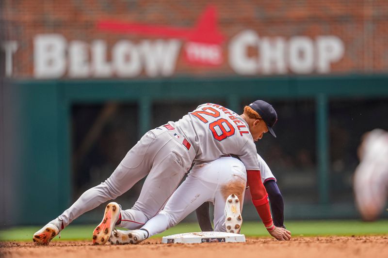 Jun 1, 2025; Cumberland, Georgia, USA; Boston Red Sox second baseman Kristian Campbell (28) is hit by Atlanta Braves shortstop Nick Allen (2) while trying to throw during the fifth inning at Truist Park. Mandatory Credit: Dale Zanine-Imagn Images