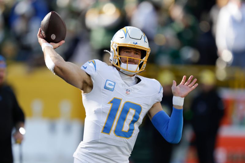 Los Angeles Chargers quarterback Justin Herbert works out prior to an NFL football game against the Green Bay Packers, Sunday, Nov. 19, 2023, in Green Bay, Wis. (AP Photo/Matt Ludtke)