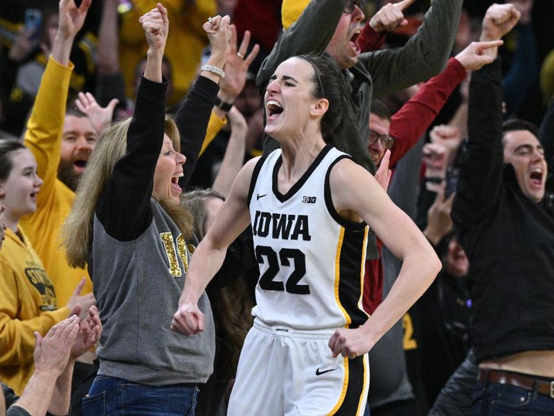 Feb 15, 2024; Iowa City, Iowa, USA; Iowa Hawkeyes guard Caitlin Clark (22) reacts with fans after breaking the NCAA women's all-time scoring record during the first quarter against the Michigan Wolverines at Carver-Hawkeye Arena. Mandatory Credit: Jeffrey Becker-USA TODAY Sports