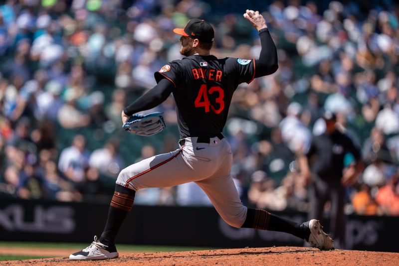 Jun 5, 2025; Seattle, Washington, USA;  Reliever Bryan Baker (43) delivers a pitch during the ninth inning against the Seattle Mariners at T-Mobile Park. Mandatory Credit: Stephen Brashear-Imagn Images