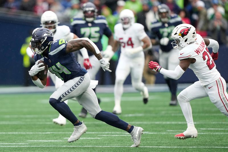 Seattle Seahawks wide receiver DK Metcalf (14) runs after a reception during the first half of an NFL football game against the Arizona Cardinals, Sunday, Nov. 24, 2024, in Seattle. (AP Photo/Stephen Brashear)