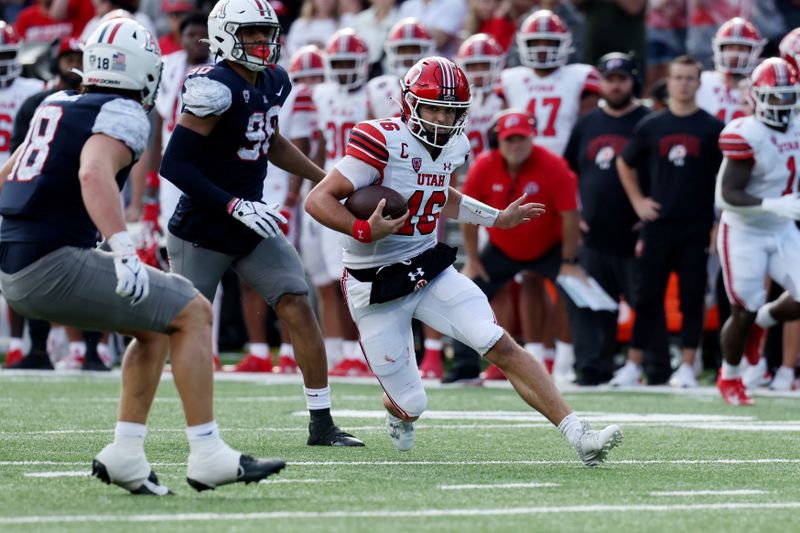 Nov 18, 2023; Tucson, Arizona, USA; Utah Utes quarterback Bryson Barnes (16) runs the ball against Arizona Wildcats linebacker Kamuela Ka'aihue (18) during the second half at Arizona Stadium. Mandatory Credit: Zachary BonDurant-USA TODAY Sports