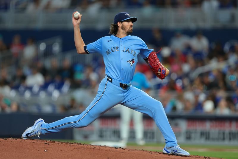 Aug 24, 2025; Miami, Florida, USA; Toronto Blue Jays starting pitcher Kevin Gausman (34) delivers a pitch against the Miami Marlins during the first inning at loanDepot Park. Mandatory Credit: Sam Navarro-Imagn Images