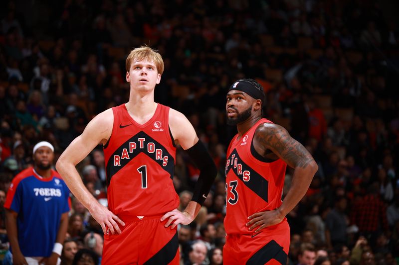 TORONTO, CANADA - OCTOBER 25: Gradey Dick #1 and Jamal Shead #23 of the Toronto Raptors look on during the game against the Philadelphia 76ers on October 25, 2024 at the Scotiabank Arena in Toronto, Ontario, Canada.  NOTE TO USER: User expressly acknowledges and agrees that, by downloading and or using this Photograph, user is consenting to the terms and conditions of the Getty Images License Agreement.  Mandatory Copyright Notice: Copyright 2024 NBAE (Photo by Vaughn Ridley/NBAE via Getty Images)