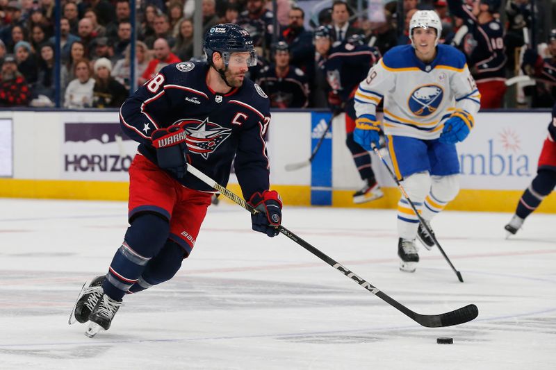 Feb 23, 2024; Columbus, Ohio, USA; Columbus Blue Jackets center Boone Jenner (38) carries the puck against the Buffalo Sabres during the first period at Nationwide Arena. Mandatory Credit: Russell LaBounty-USA TODAY Sports