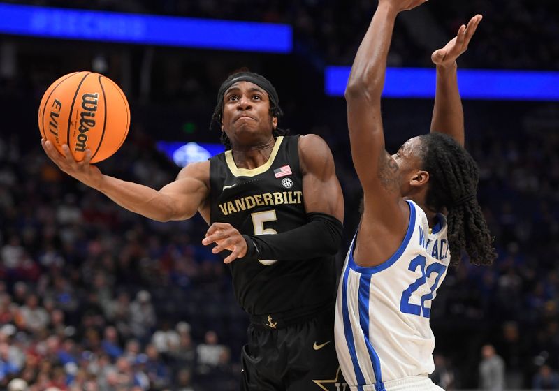 Mar 10, 2023; Nashville, TN, USA; Vanderbilt guard Ezra Manjon (5) goes to the basket during the first half against the Kentucky Wildcats at Bridgestone Arena. Mandatory Credit: Steve Roberts-USA TODAY Sports