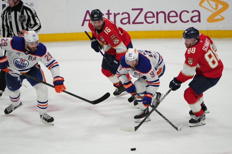 Jun 9, 2025; Sunrise, Florida, USA; iEdmonton Oilers center Connor McDavid (97) battles for the puck against Florida Panthers defenseman Nate Schmidt (88) during the third period n game three of the 2025 Stanley Cup Final at Amerant Bank Arena. Mandatory Credit: Jim Rassol-Imagn Images