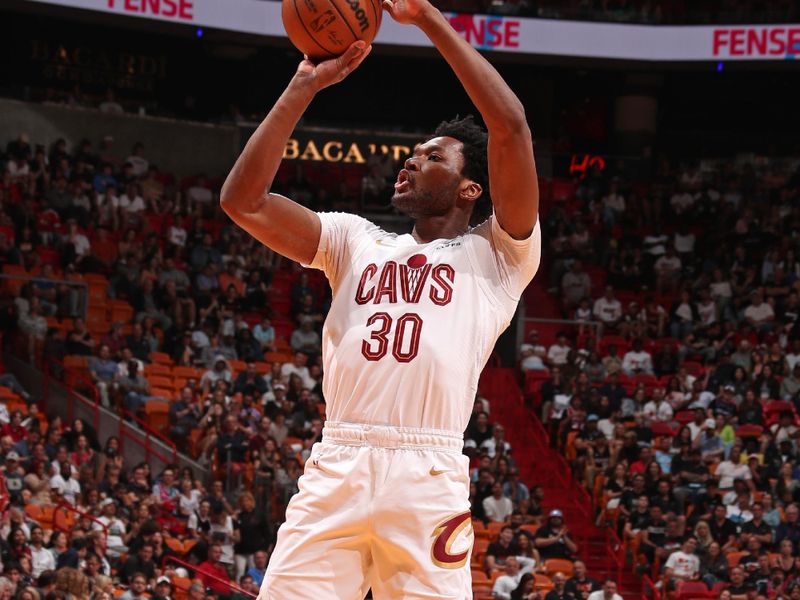 MIAMI, FL - MARCH 24: Damian Jones #30 of the Cleveland Cavaliers shoots the ball during the game against the Miami Heat on March 24, 2024 at Kaseya Center in Miami, Florida. NOTE TO USER: User expressly acknowledges and agrees that, by downloading and or using this Photograph, user is consenting to the terms and conditions of the Getty Images License Agreement. Mandatory Copyright Notice: Copyright 2024 NBAE (Photo by Issac Baldizon/NBAE via Getty Images)