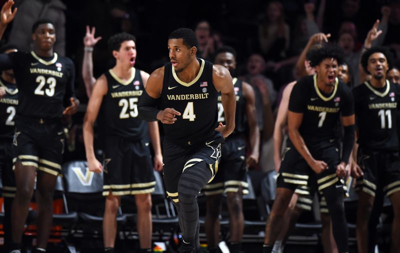 Jan 14, 2023; Nashville, Tennessee, USA; Players on the Vanderbilt Commodores bench celebrate after a basket by guard Jordan Wright (4) during the second half against the Arkansas Razorbacks at Memorial Gymnasium. Mandatory Credit: Christopher Hanewinckel-USA TODAY Sports