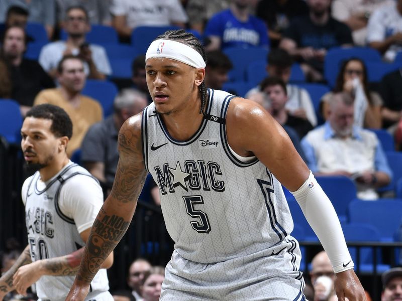 ORLANDO, FL - FEBRUARY 10: Paolo Banchero #5 of the Orlando Magic plays defense during the game against the Atlanta Hawks on February 10, 2025 at Kia Center in Orlando, Florida. NOTE TO USER: User expressly acknowledges and agrees that, by downloading and or using this photograph, User is consenting to the terms and conditions of the Getty Images License Agreement. Mandatory Copyright Notice: Copyright 2025 NBAE (Photo by Fernando Medina/NBAE via Getty Images)