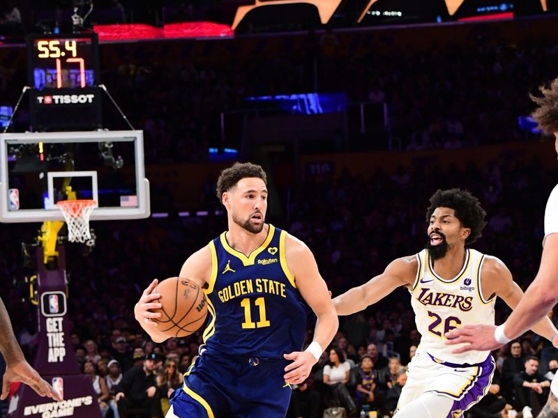 LOS ANGELES, CA - MACH 16: Klay Thompson #11 of the Golden State Warriors handles the ball during the game against the Los Angeles Lakers on March 16, 2024 at Crypto.Com Arena in Los Angeles, California. NOTE TO USER: User expressly acknowledges and agrees that, by downloading and/or using this Photograph, user is consenting to the terms and conditions of the Getty Images License Agreement. Mandatory Copyright Notice: Copyright 2024 NBAE (Photo by Adam Pantozzi/NBAE via Getty Images)