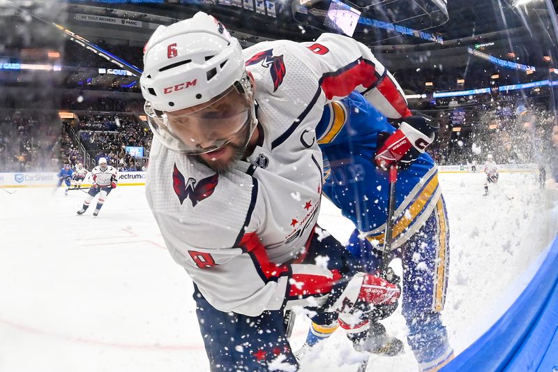 Jan 20, 2024; St. Louis, Missouri, USA;  Washington Capitals left wing Alex Ovechkin (8) is checked by St. Louis Blues right wing Kevin Hayes (12) during the first period at Enterprise Center. Mandatory Credit: Jeff Curry-USA TODAY Sports