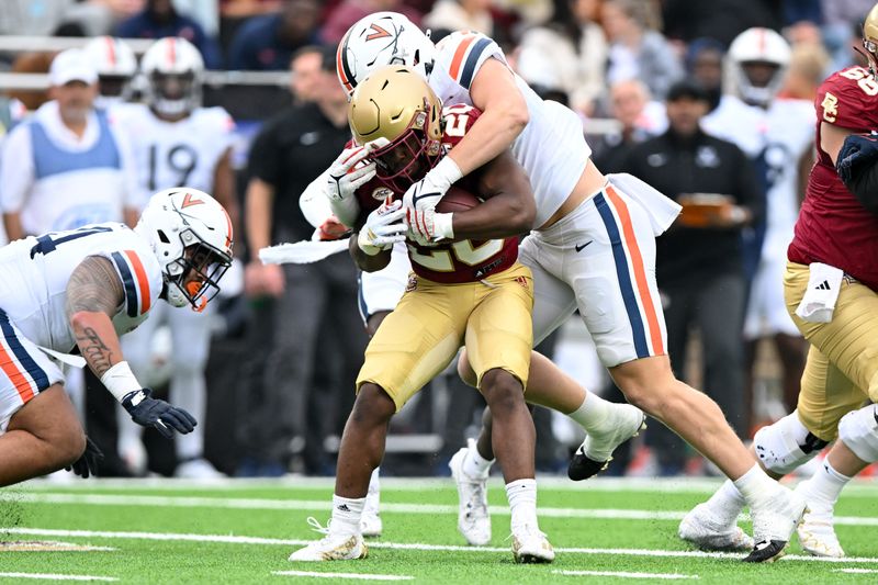 Sep 30, 2023; Chestnut Hill, Massachusetts, USA; Virginia Cavaliers linebacker James Jackson (7) tackles Boston College Eagles running back Alex Broome (20) during the first half at Alumni Stadium. Mandatory Credit: Brian Fluharty-USA TODAY Sports