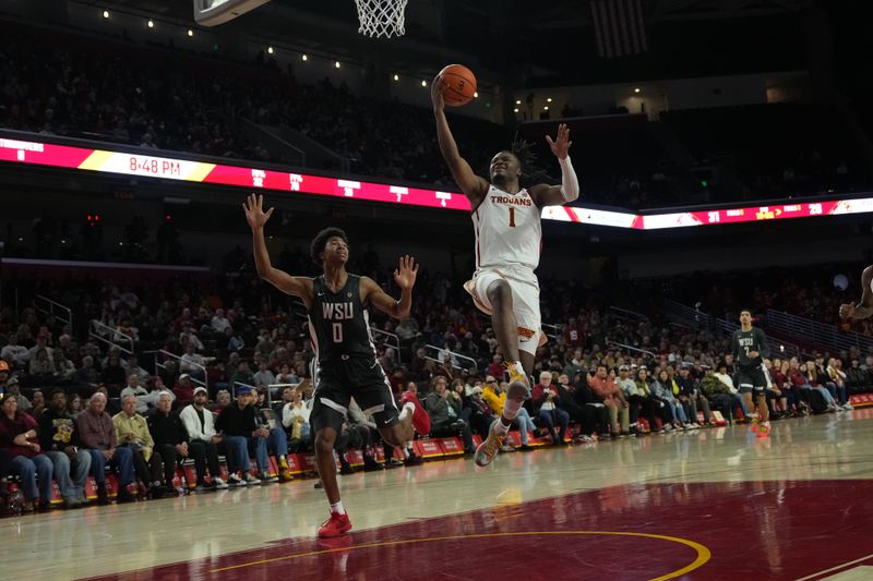 Jan 10, 2024; Los Angeles, California, USA; Southern California Trojans guard Isaiah Collier (1) shoots the ball against Washington State Cougars forward Jaylen Wells (0) Galen Center. Mandatory Credit: Kirby Lee-USA TODAY Sports