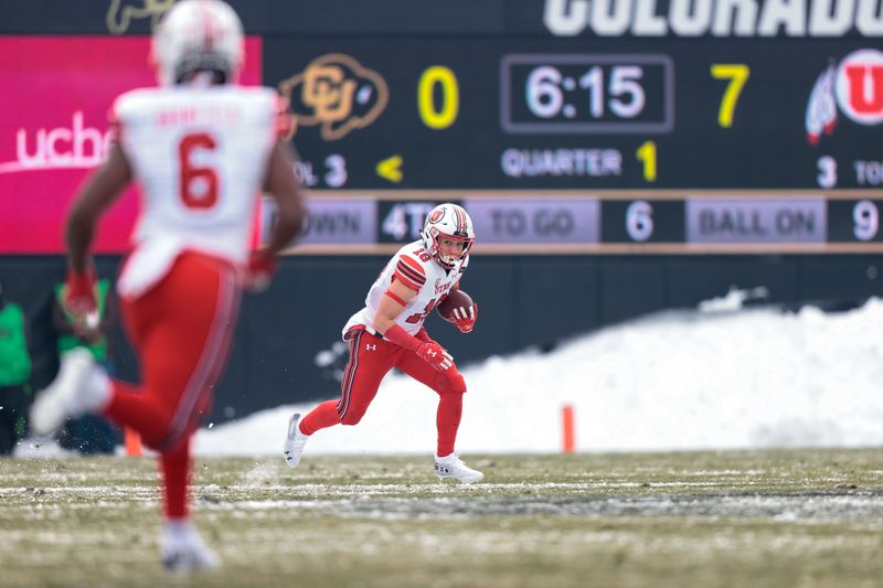 Dec 12, 2020; Boulder, Colorado, USA; Utah Utes wide receiver Britain Covey (18) runs the ball on a punt return in the first quarter against the Colorado Buffaloes at Folsom Field. Mandatory Credit: Isaiah J. Downing-USA TODAY Sportsffd